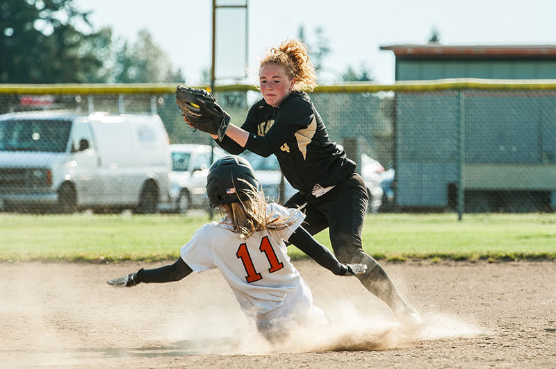 Returning sophomore Taylor Miller slides into second base in a softball game against Meridian High School last spring. Photo by Janell Kortlever.